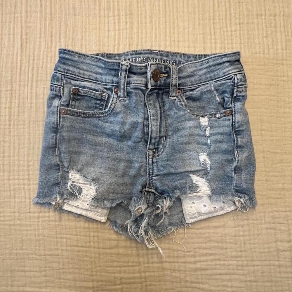 American Eagle distressed denim shorts with eyelet lace pocket detailing